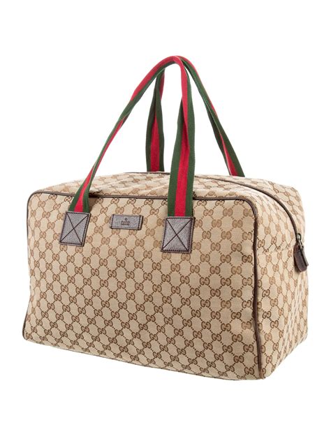 gucci canvas duffle bag.